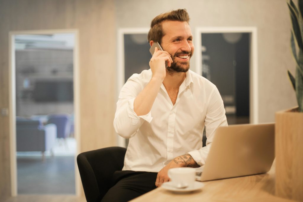 Photo by Andrea Piacquadio: https://www.pexels.com/photo/smiling-formal-male-with-laptop-chatting-via-phone-3760263/